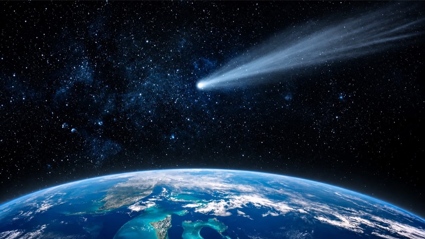 A luminous comet with a sweeping tail in deep space